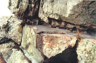 A layer of mercury & iron oxide bonded to blocks of sandstone